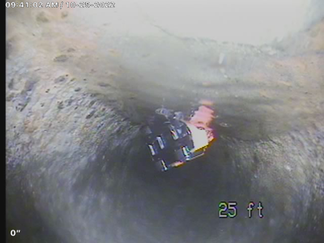 Sewer camera inspection view 25 feet into a main line showing pipe condition