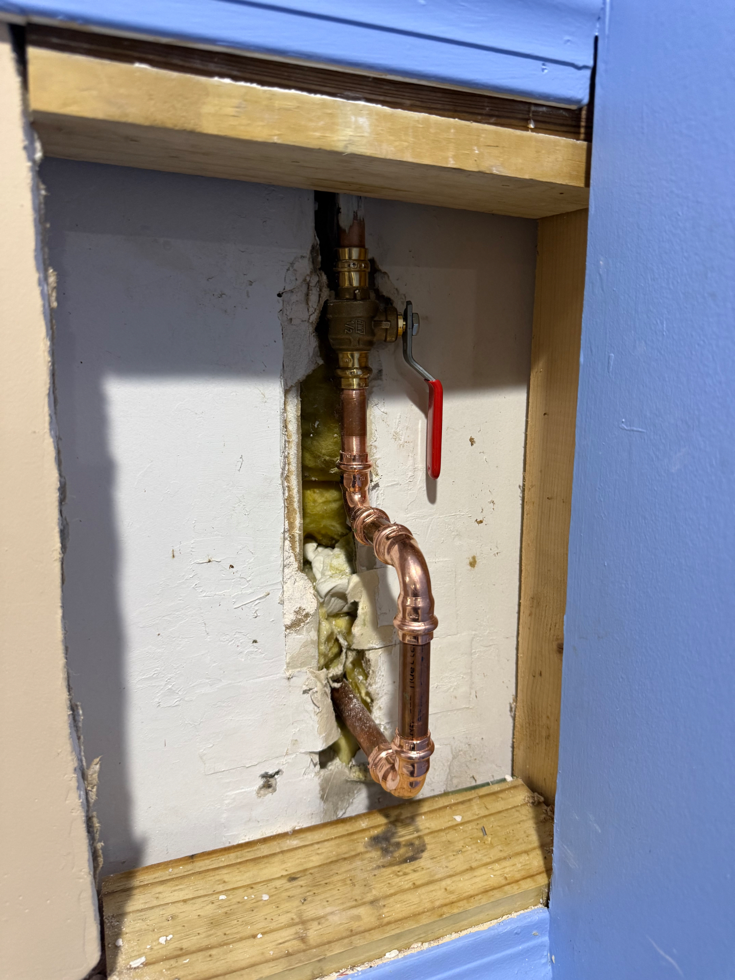 New copper outdoor faucet piping and shutoff valve installed in a Cheshire wall