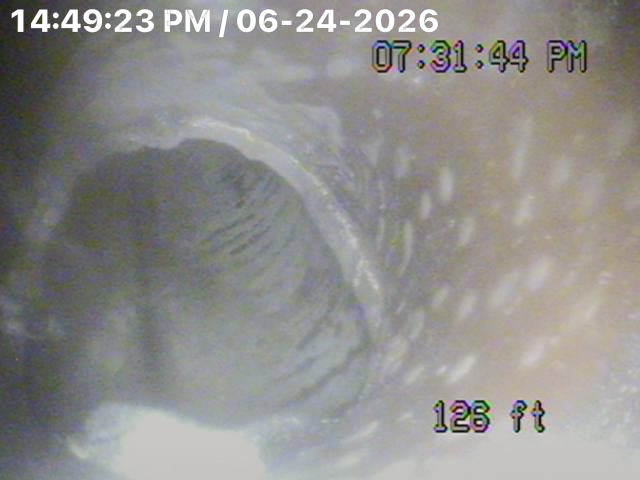 126 ft down a commercial line: heavy scale and grease buildup restricting flow. Hydro jetting restores these lines to like-new condition.