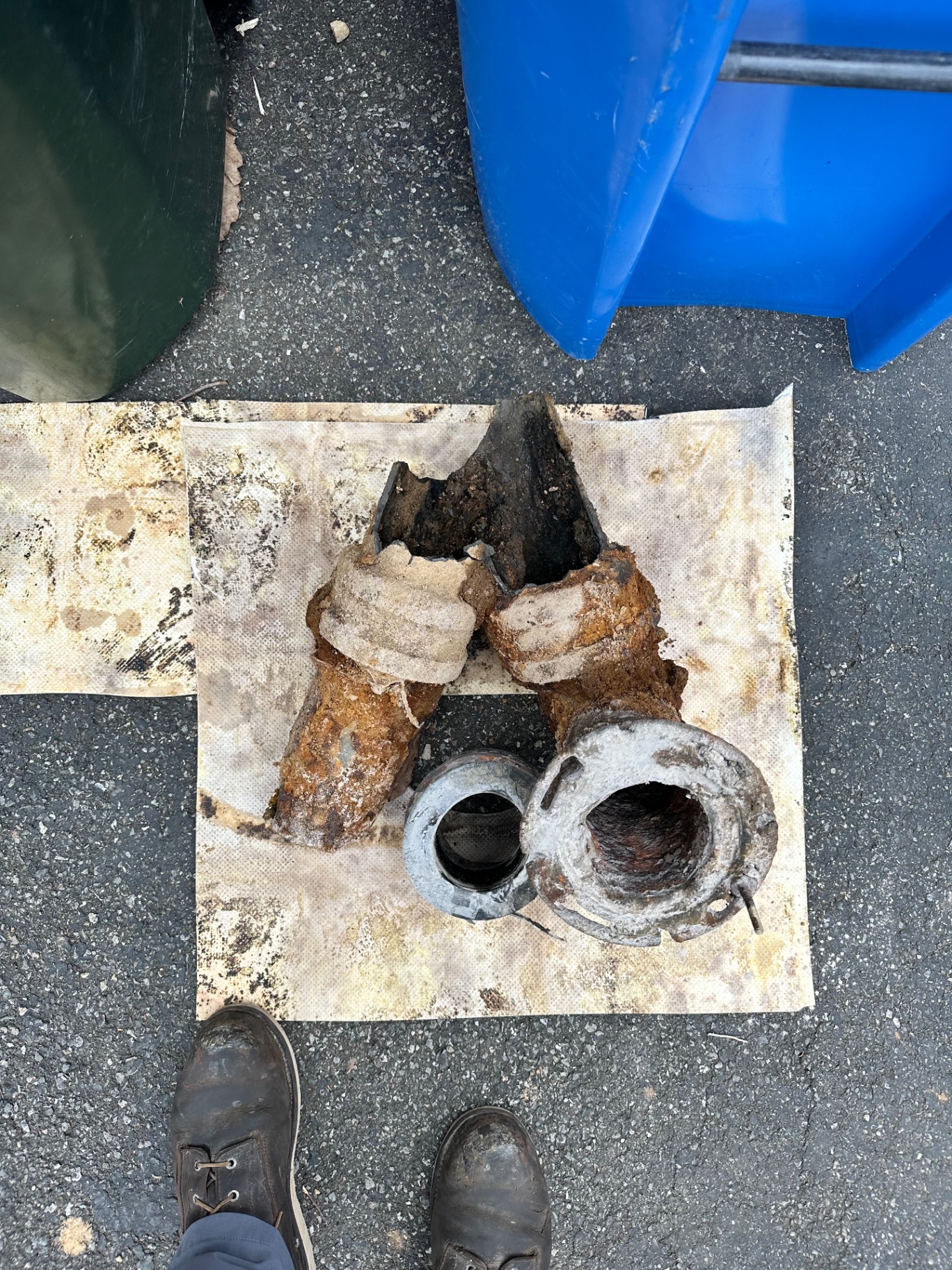 Sections of heavily corroded cast iron drain pipe removed from a Madison home